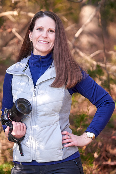 Portrait photo of Danielle holding a camera